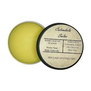 Handcrafted Calendula Salve in a black tin featuring natural ingredients for skin healing - calendula-salve-caster-olive-oil-bees-wax-heal-wounds-rashes-dry-skin_1x1_isolate-1.webp